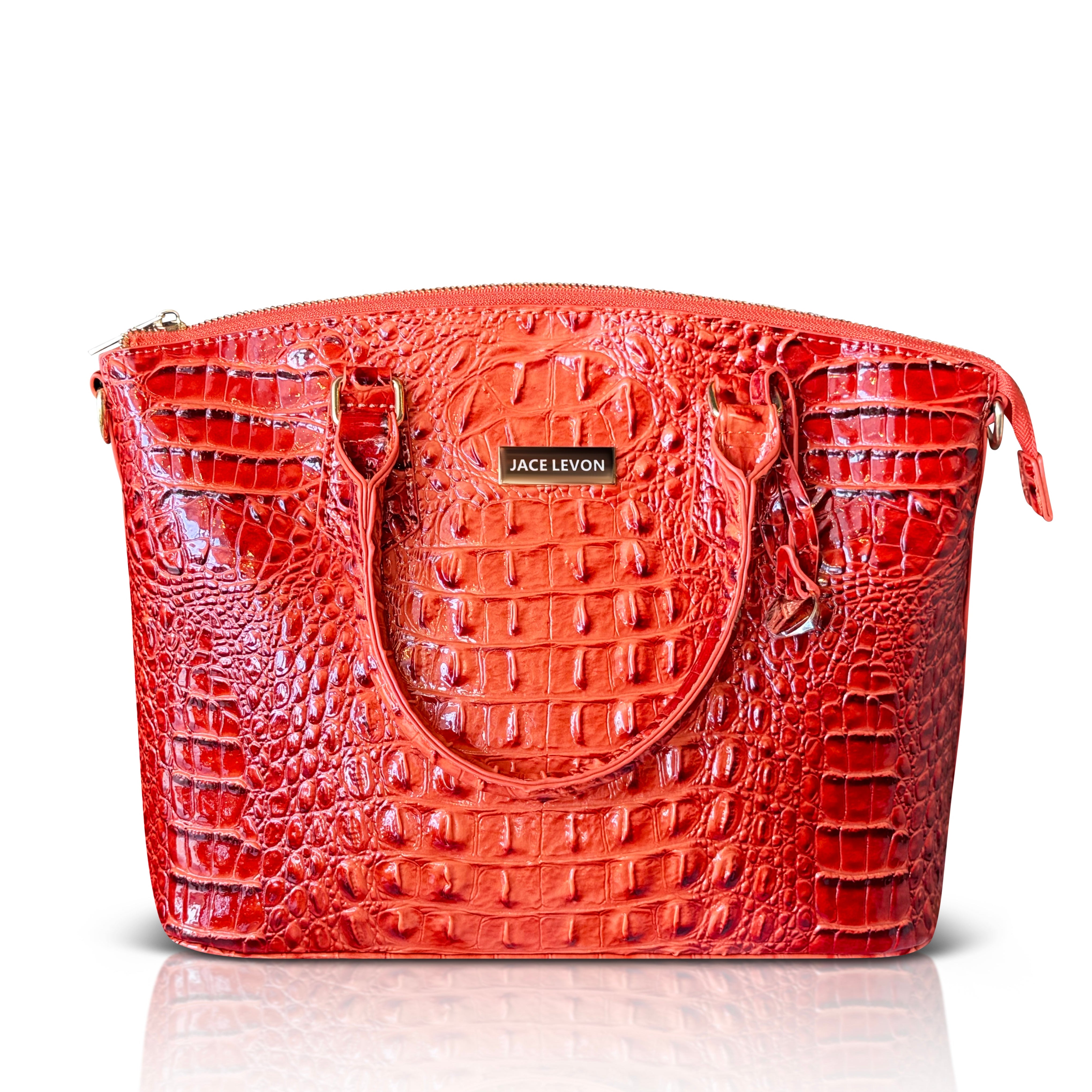 Red handbag with crocodile texture on a white background
