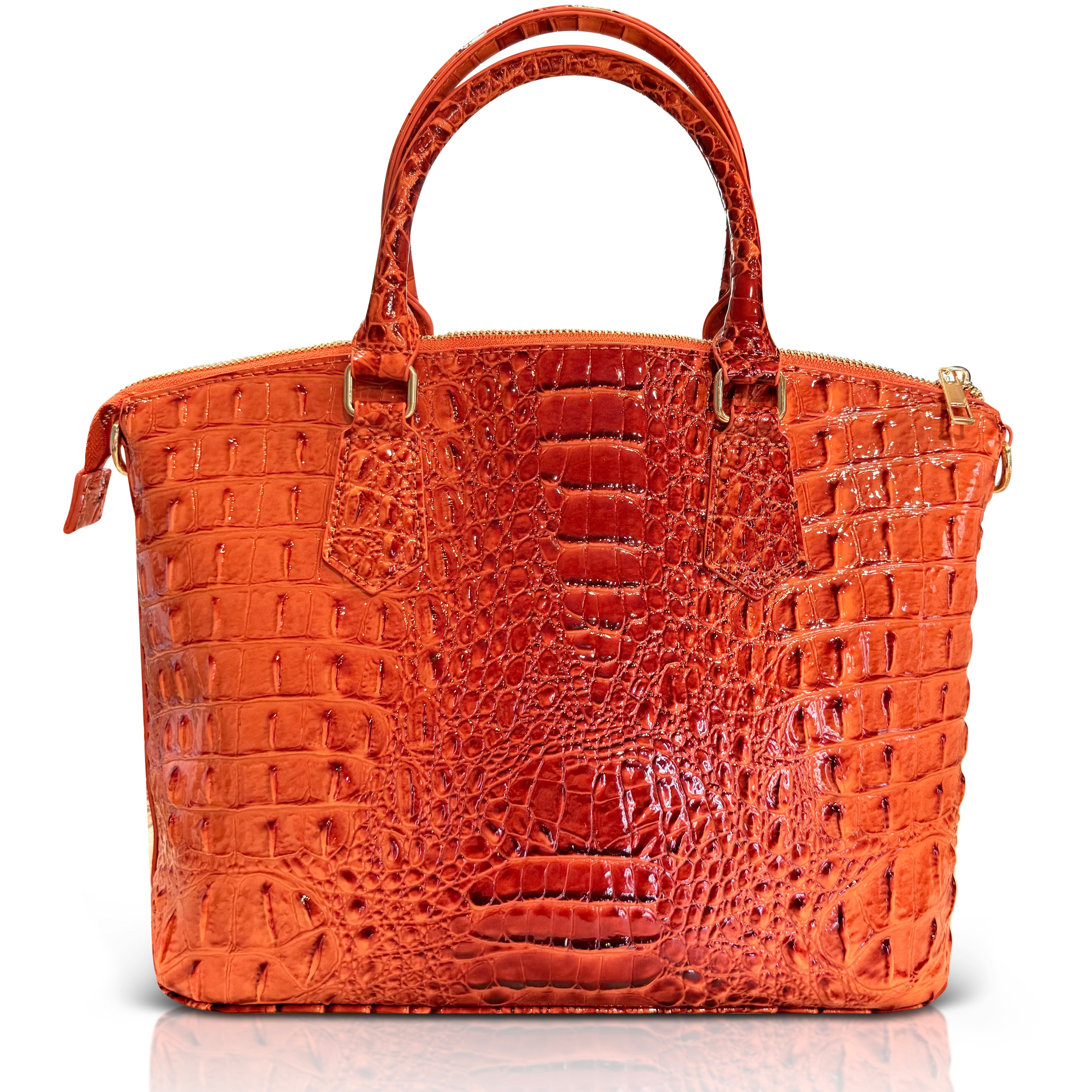 Orange crocodile-patterned handbag on a white background
