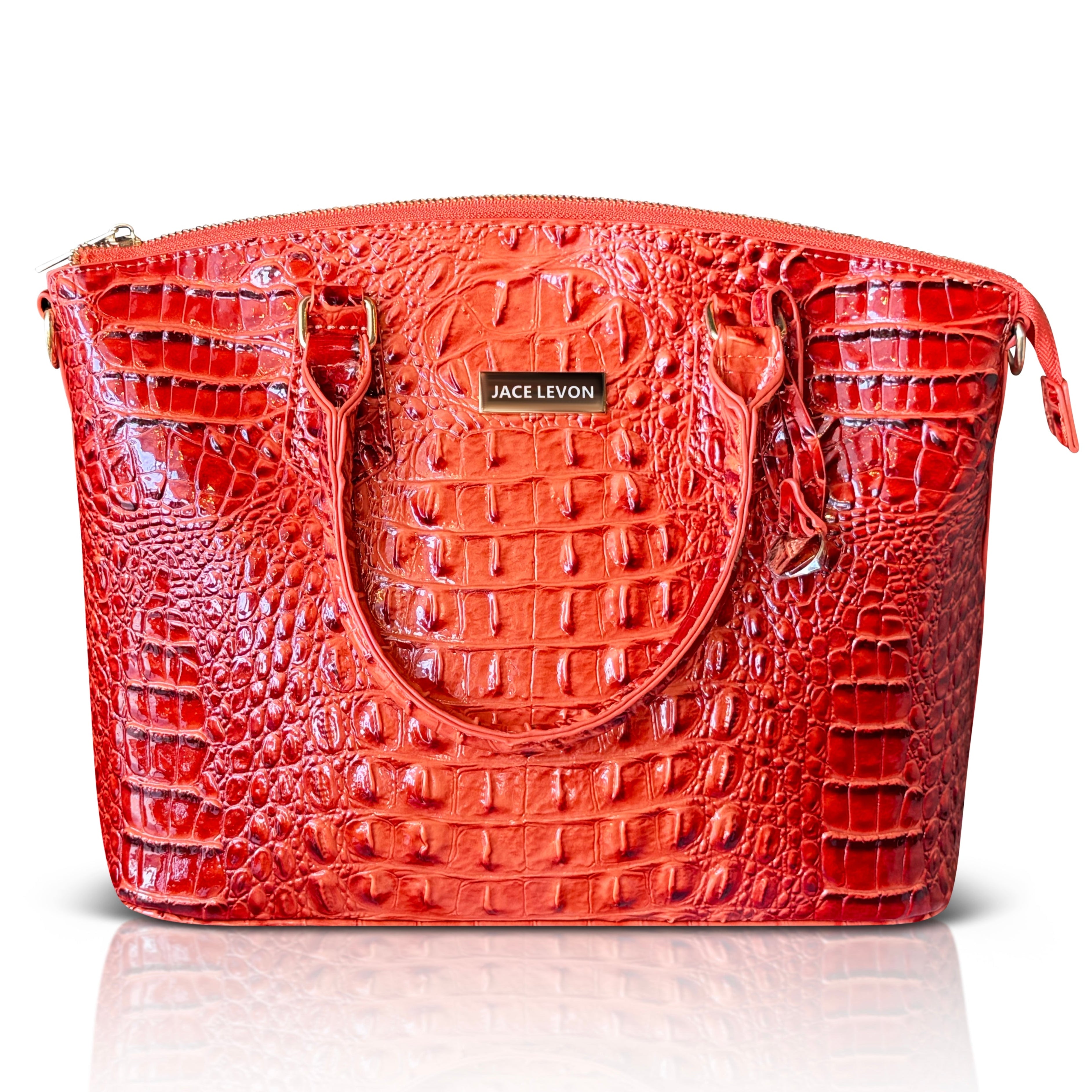 Red handbag with crocodile texture on a white background
